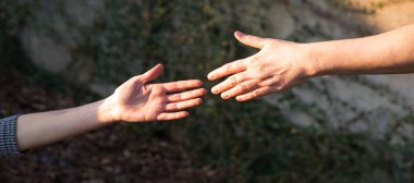 Close up old despair stress pray young male guy finger extreme sport achieve union worker god trust hope pit Closeup addict girl prayer ask raise rock cliff abyss free power social trap escape overcom