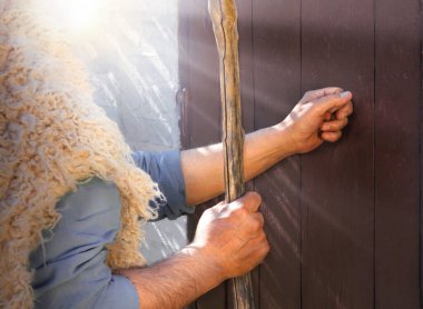 Close up retro rustic rural front dark black church visit adult age saint Peter ask arab open gate. Arabian middle east holy jew Joseph cloth walk Lord story hold rod pray gospel concept text space