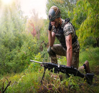 Alone tired sad USA navy unit male guy kneel rest hope hand face ptsd pain post danger dark forest tree bush. Lone worry human cry feel mental upset mourn lost hero god faith worship crisis concept