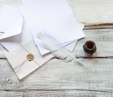 Closeup top view classic rustic age send notepad gift book tool art style sign symbol craft delivery. Grunge wax seal stamp rope tie tag close pack light worn table desk text space artist banner decor