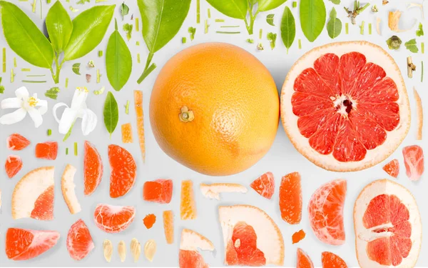 Grapefruitový Kus Ovoce Sbírka Plátků Listů Ploché Hladké Abstraktní Pozadí — Stock fotografie