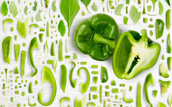 Abstract Background Made Green Pepper Vegetable Pieces Slices Leaves Wooden — Stock Photo, Image
