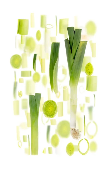 Abstracte Achtergrond Gemaakt Van Prei Plantaardige Stukken Plakken Bladeren Geïsoleerd — Stockfoto