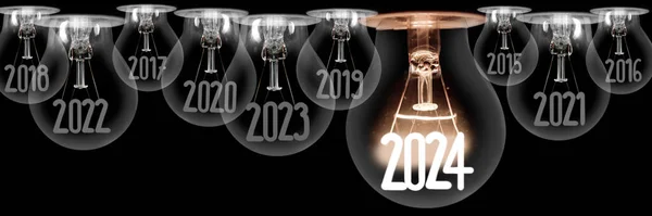 一组横向发光灯泡 纤维形状为2024年新年 淡淡的灯泡 多年来与黑色背景隔离 图库图片