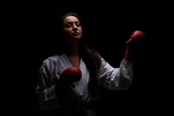 Girl Exercising Karate Punch Wearing Kimono Red Gloves Black Background — Fotografie, imagine de stoc