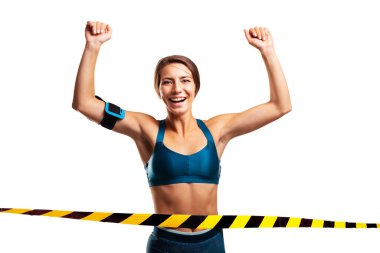 Portrait of a girl runningthe finish line. Female runner isolated on white background.