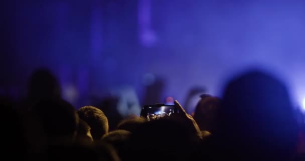 Abstract Silhouette People Crowd Hands Dancing Holding Smart Phones Flashes — Vídeo de stock