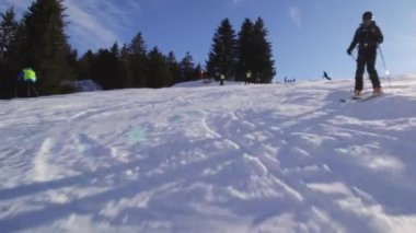 male skier skiing on slopes in the Swiss alps