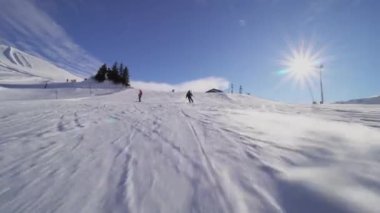 male skier skiing on slopes in the Swiss alps