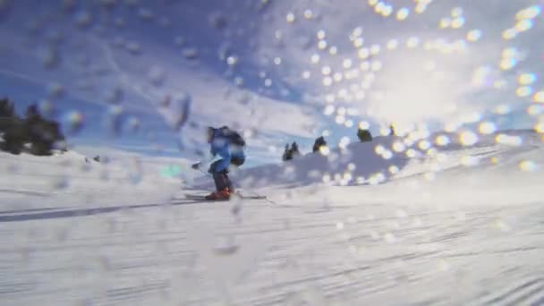 Professional Skier Skiing Slopes Swiss Alps Sun Rays Lens Flare — Stock Video