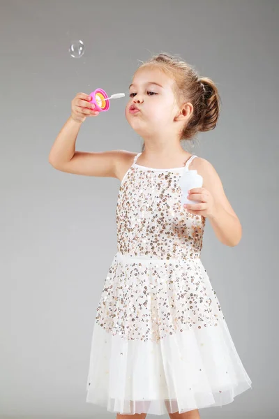 Little Girl Making Foam Balloons Studio Shot — Stock Photo, Image