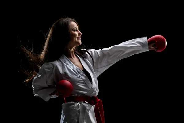 Girl Exercising Karate Punch Wearing Kimono Red Gloves Black Background — Stok fotoğraf