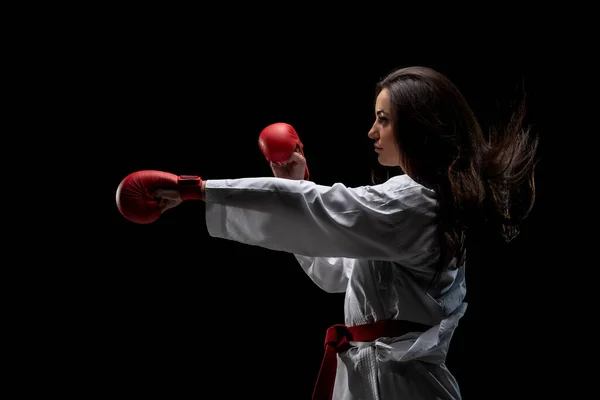 Girl Exercising Karate Punch Wearing Kimono Red Gloves Black Background — Stockfoto