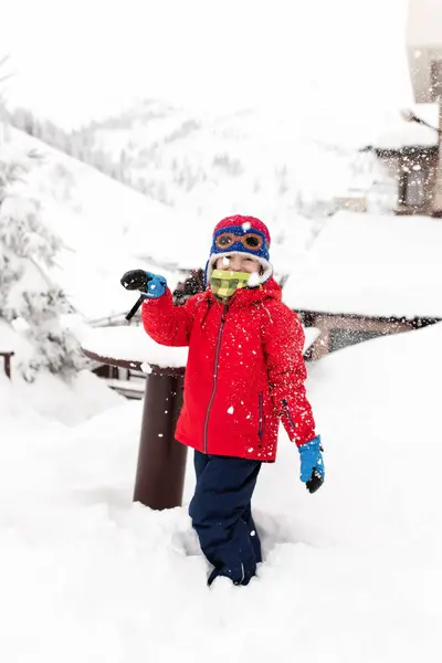 Little Boy Cold Winter Day Mountains Playing Snow Throwing Snow Foto Stock