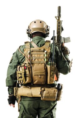 Soldier viewed from behind, wearing green combat attire, tactical gear, helmet, backpack, and holding a rifle. Suitable for illustrating military, tactical operations, or combat readiness concepts.