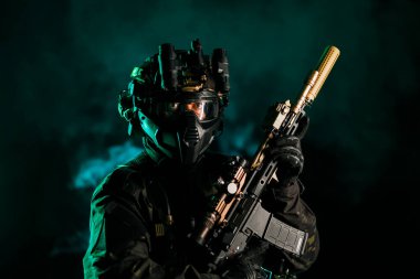 A tactical operative wearing high-tech gear with a rifle, set against a smoky background. This depiction emphasizes readiness, precision, and advanced technology, reflecting a modern approach to