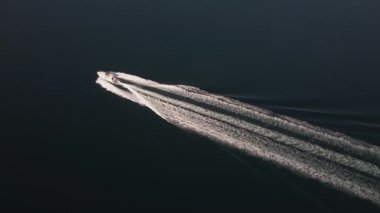 Speedboat cruising on the Aegean Sea near Ammouliani Island, Greece. Perfect for travel, tourism, and leisure projects.