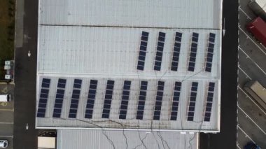 Aerial view of solar panels on the roof of a gas station. This sustainable energy solution helps reduce the carbon footprint.