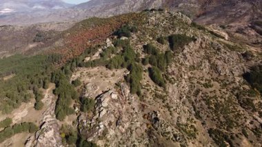 Aerial drone video flying over rocky mountain in the balkans.