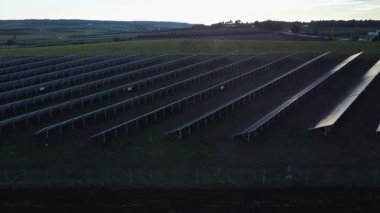 Solar panels at sunset. Clean energy, renewable resources, and sustainable development in Greece. Twilight Reflections.