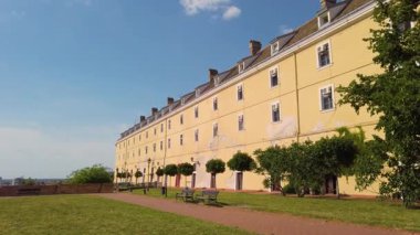 Wander through the scenic grounds of Petrovaradin fortress in Novi Sad, soaking in the warm sunlight and admiring the stunning architecture that draws visitors from afar.