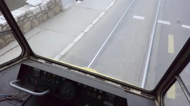 Experience an authentic point of view from inside an old tram on the historical tracks of Sarajevo.