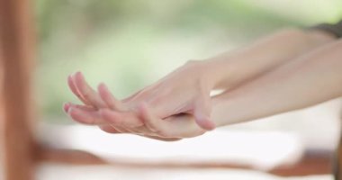 The video demonstrates effective hand stretching techniques to alleviate stress, promoting relaxation in a calm outdoor space surrounded by nature. Ideal for daily practice.