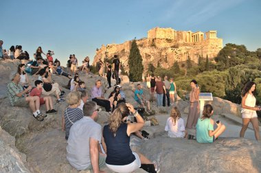 Athens, Greece - July 15, 2017: The tourist group and guide excursion on the Areopagus Hill.