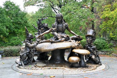 NEW YORK - 23 OCT 2022: The Alice in Wonderland Statue in Central Park, with Alice, the Mad Hatter and the White Rabbit.