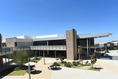 IRIVNE, CALIFORNIA - 2 APR 2023: Classroom Building on the Campus of Portola High School. clipart
