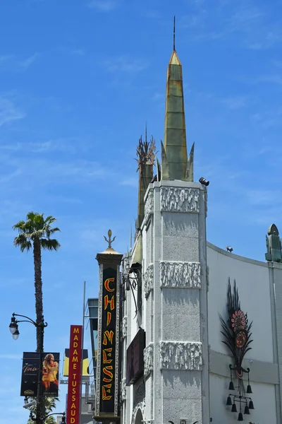 stock image HOLLYWOOD, CALIFORNIA - 12 MAY 2023: Chinese sign on the The TCL Chinese Theatre on Hollywood Boulevard, with the Madame Tussauds in the background.