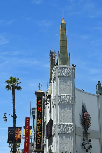 Stock image HOLLYWOOD, CALIFORNIA - 12 MAY 2023: Chinese sign on the The TCL Chinese Theatre on Hollywood Boulevard, with the Madame Tussauds in the background.