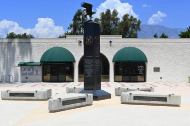 UPLAND, CALIFORNIA - 14 JULY 2024: The Upland City Hall and memorail in the Veterans Plaza. clipart