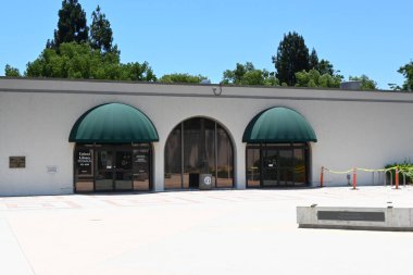 UPLAND, CALIFORNIA - 14 JULY 2024: The Upland Public Library in the Civic Center on Euclid Avenue. clipart