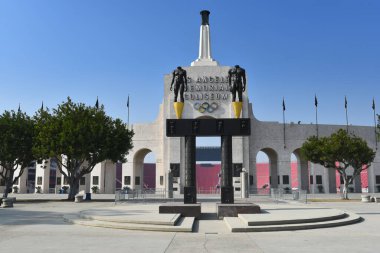 LOS ANGELES, CALIFORNIA - 4 DEC 2024: Main entrance to the Los Angeles Memorial Coliseum in Exposition Park. clipart