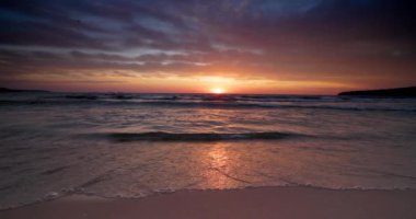 Relaxing sunrise on the beach shore. Sunset over the ocean and seascape, 4K inspirational video