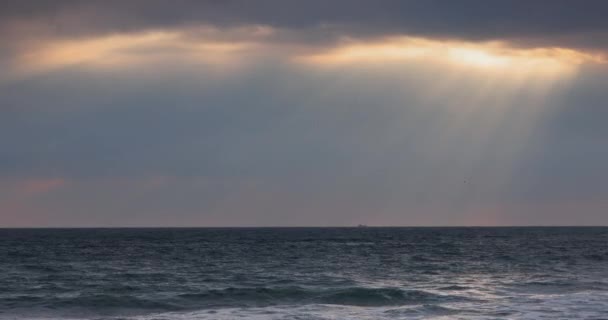 Sea Sunrise Dark Clouds Sunrays Though Dramatic Clouds Beach Water — Stock Video