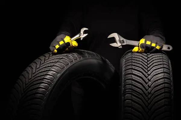 Winter Car Tires Service Hands Mechanic Wrench Screwdriver Black Backgroun — Stock Photo, Image