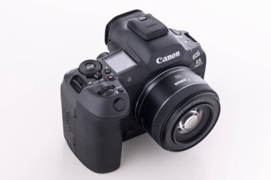 Varna, Bulgaria - August 31,2024: Image of Canon EOS R5 Mark II Mirrorless Digital Camera with Canon RF 50 mm F 1.8  STM  lens on a white background. Canon is the world largest SLR camera manufacturer.  clipart