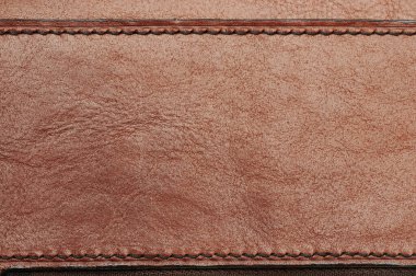 Çerçeve dikişli kahverengi deri arka plan yakın görünüm