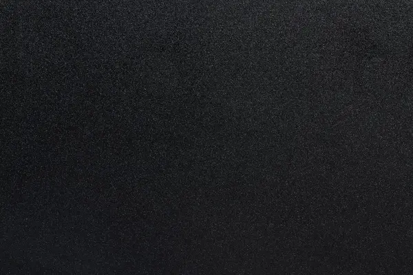 Matte black metal pattern macro close up view