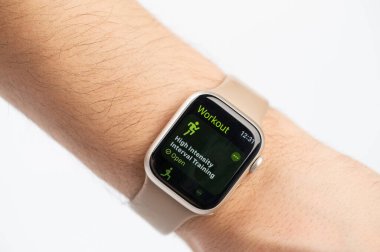 New York, USA - October 9, 2023: Workout app on apple watch screen macro close up view wrist isolated clipart