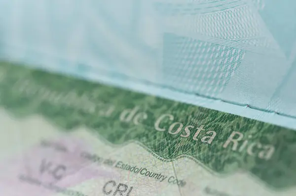 stock image Travel costa rica visa in passport macro close up view