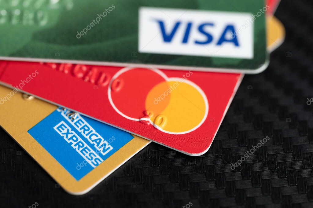 New York, USA - August 2, 2023: Variety of colorful credit cards to pay in different system close up view