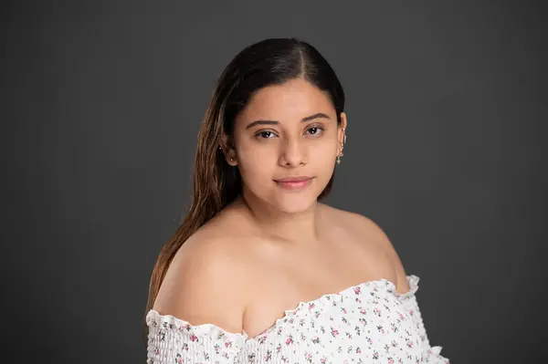 stock image Headshot of young woman with ear piercing  on studio background