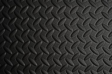 Siyah dayanıklı eğimli arka plan. Endüstriyel plastik panel yüzeyi