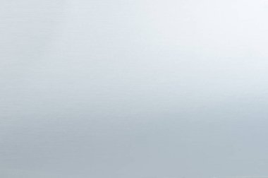 Açık gri metal cilalı kağıt arkaplan gradyan dokusu yakın görünüm