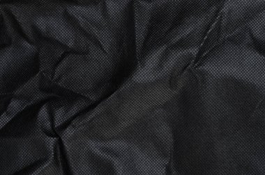 Siyah kumaş dokuyu yakın görünüm ile dalgalandırdı