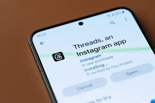 stock image New York, USA - July 7, 2023: Installing threads instagram app on smartphone screen close up view