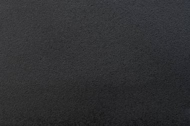 Siyah mat plastik malzeme dokusu arka plan makro yakın görünüm
